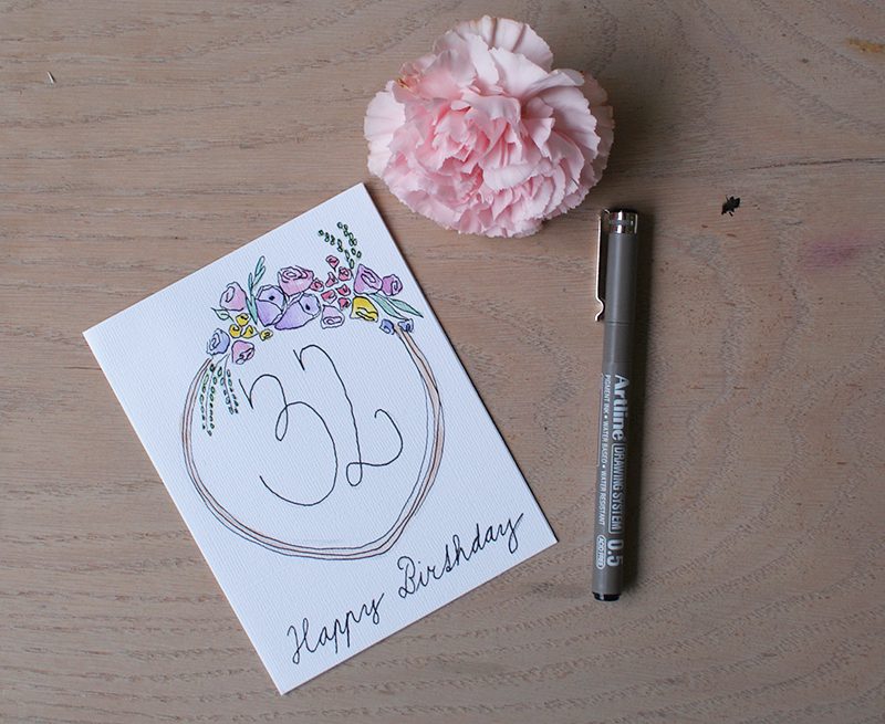 Make a watercolor birthday card with a floral motif